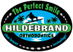 Hildebrand Orthodontics logo featuring mountains, trees, and "The Perfect Smile" tagline in oval badge design.