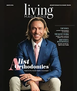 Professional man in blue blazer featured on Living Magazine cover about orthodontics.